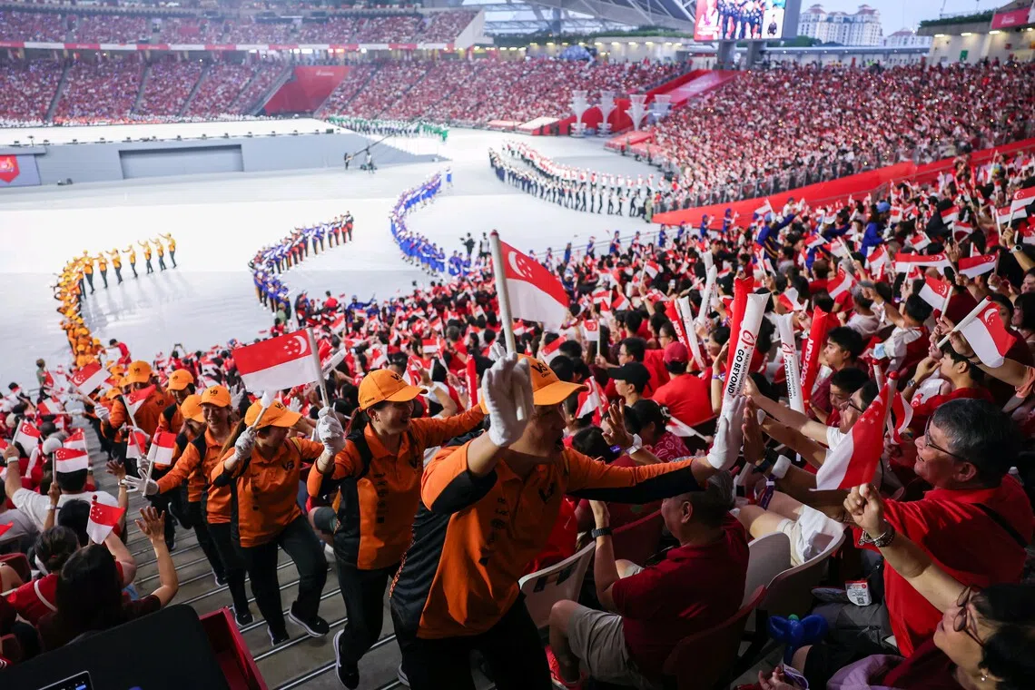 Parade contingents marching off during National Day Parade 2026 at the National Stadium on Aug 9, 2026. ST PHOTO: BRIAN TEO
