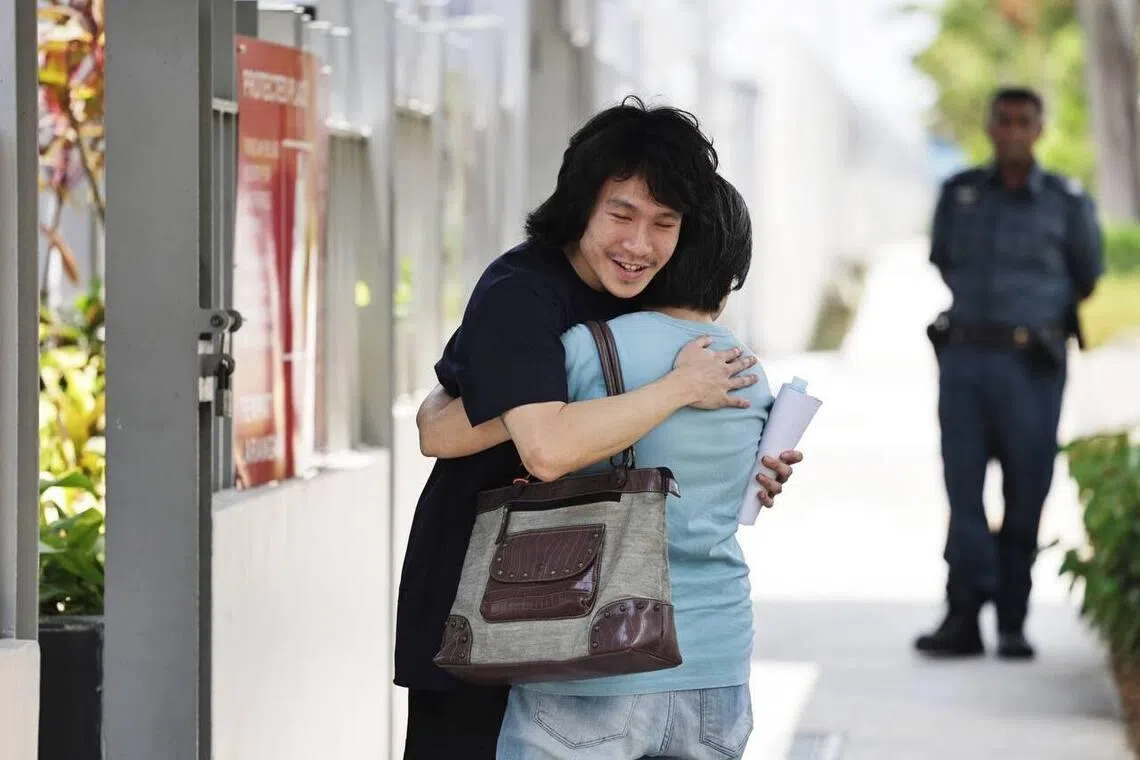 Amos Yee hugging his mother after his release from Changi Prison.