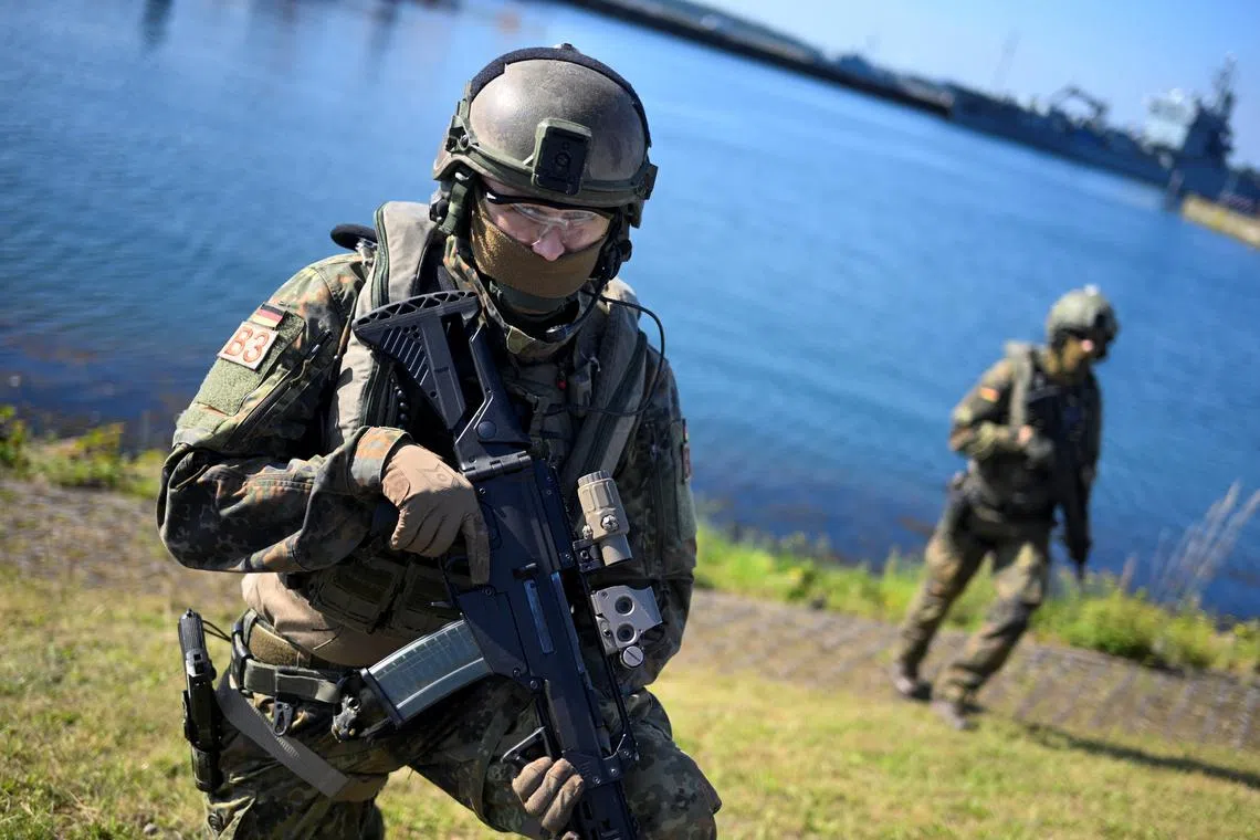 FILE PHOTO: Soldiers participate in a showcase, on the day of Germany's Defence Minister Boris Pistorius' visit to a submarine squadron and naval battalion of the Bundeswehr in Eckernfoerde, Germany, July 19, 2024. REUTERS/Fabian Bimmer/File Photo