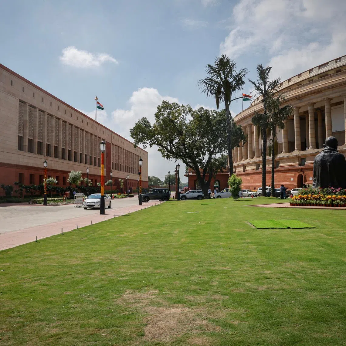 FILE PHOTO: A view shows India's new (L) and old parliament buildings in New Delhi, India, September 18, 2023. REUTERS/Adnan Abidi/File Photo
