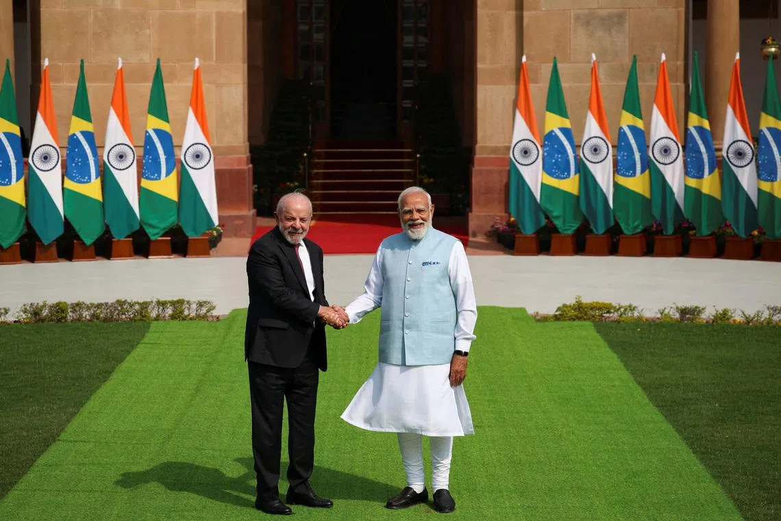 Indian Prime Minister Narendra Modi shakes hands with Brazilian President Luiz Inacio Lula da Silva, ahead of their meeting at Hyderabad House in New Delhi, India, February 21, 2026. REUTERS/Adnan Abidi