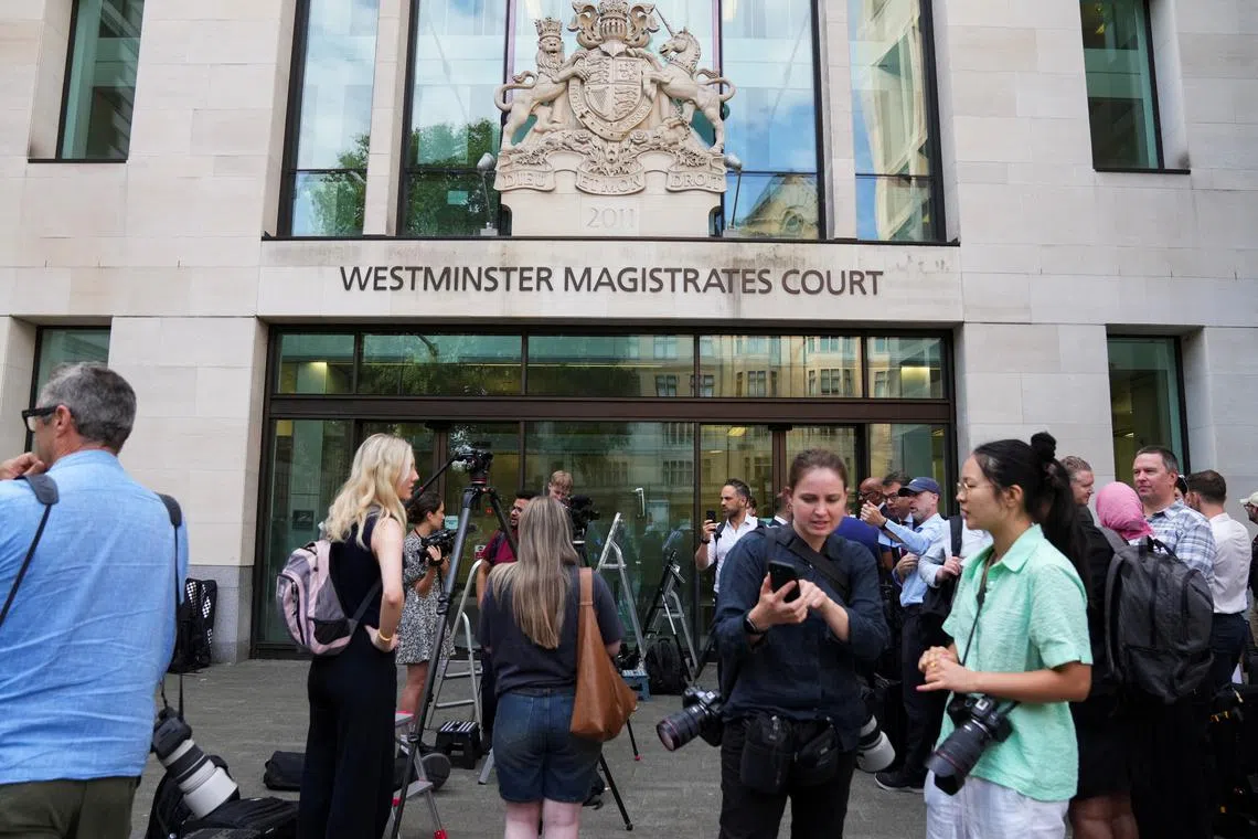 FILE PHOTO: Members of the media wait outside Westminster Magistrates' Court, in London, Britain, July 31, 2024. REUTERS/Maja Smiejkowska/File photo