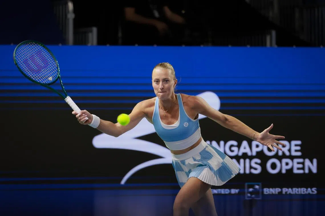 France’s Kristina Mladenovic playing a return to Japan’s Nao Hibino in the women’s singles round of 32 of the Singapore Tennis Open at OCBC Arena on Sept 21.