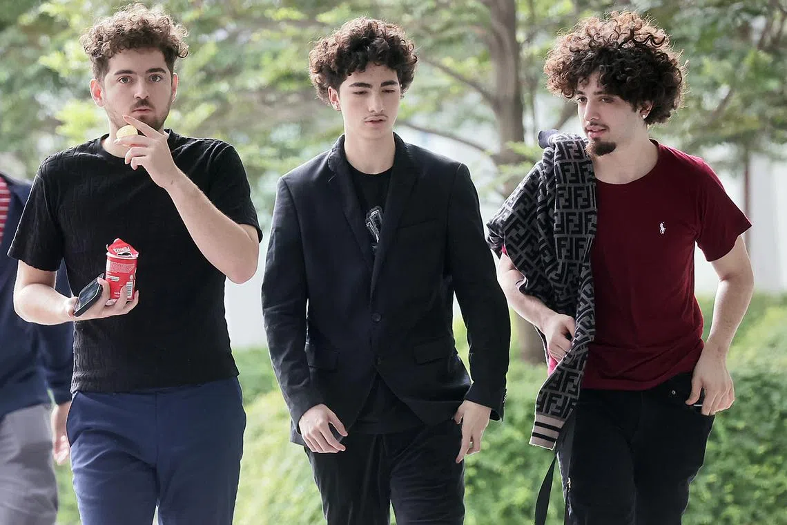 ID confirmed by photog Kelvin Chng and Christine ST//

(in Black jacket and pant, curlty hair)Alejandro Martinez-Arizala JR
(in Black Tee and blue Jean)Albert Max Martinex-Arizala
(in Red Tee and black pant)Alexis Jesus Martinez-Arizala

They are 3 American men who were caught with knives in Orchard Road. Pleading guilty at 11am in 11C (Andrew)