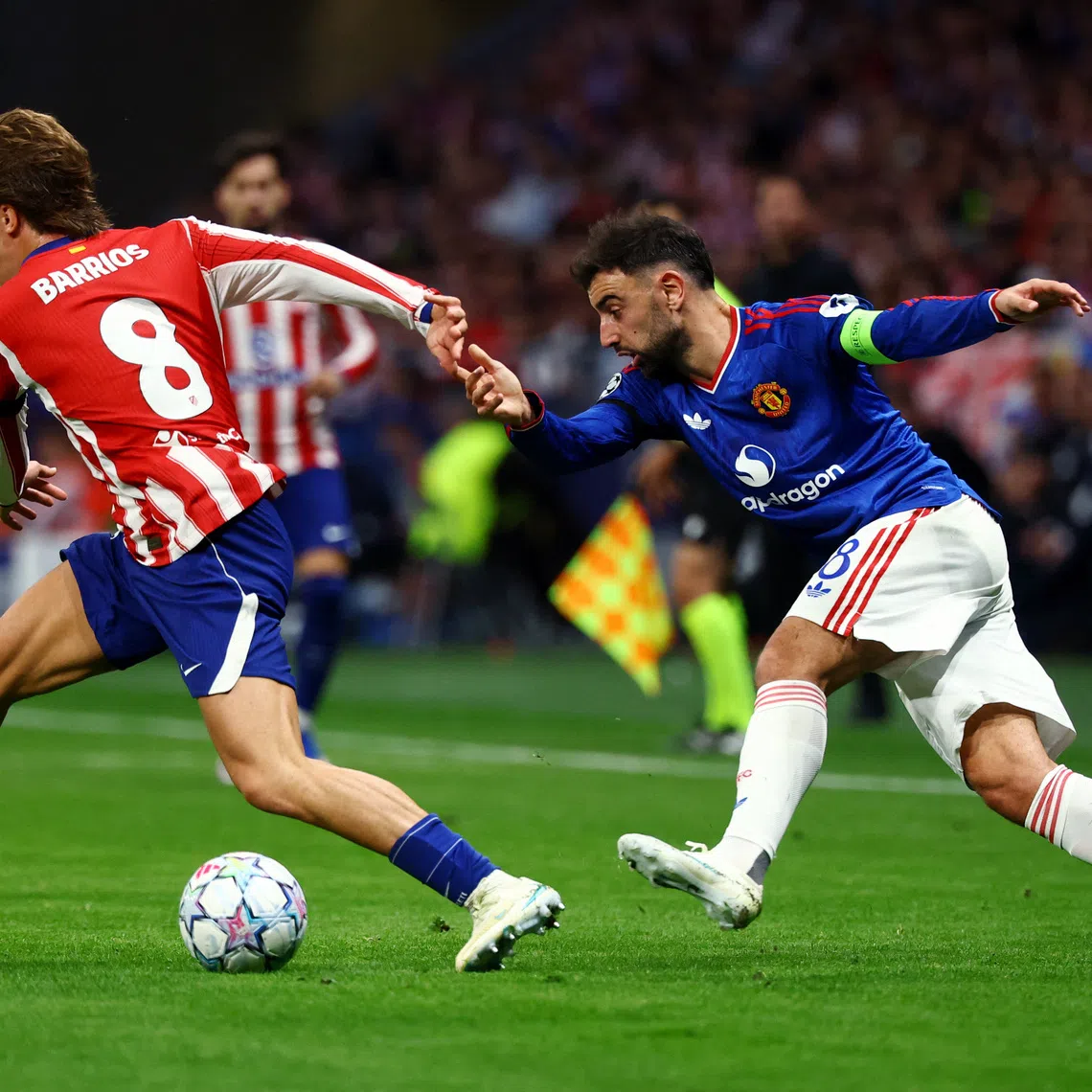 Manchester United’s Bruno Fernandes in action with Atletico Madrid’s Pablo Barrios during their UEFA Champions League match on Oct 13.