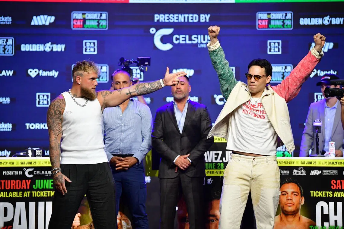 May 14, 2025; Los Angeles, California, USA; Jake Paul and Julio Cesar Chavez Jr. pose for photos following their press conference at Avalon Hollywood Theater. Mandatory Credit: Gary A. Vasquez-Imagn Images