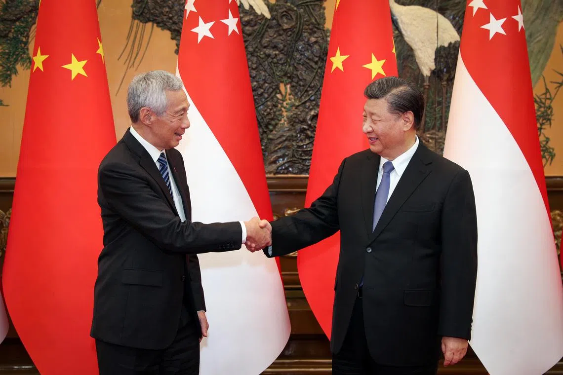 Singapore PM Lee Hsien Loong meeting China’s President Xi Jinping at the Great Hall of the People on March 31, 2023