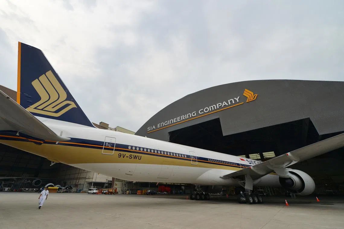 An SIA Boeing 777-300 at an SIA Engineering Company hangar in Changi. Photographed 25 September 2013. Can be used with stories about SIA, Changi, Boeing, 777, plane, aircraft, engineering, SIAEC, hangar, tarmac, runway, service, tail, SQ, Singapore, long haul