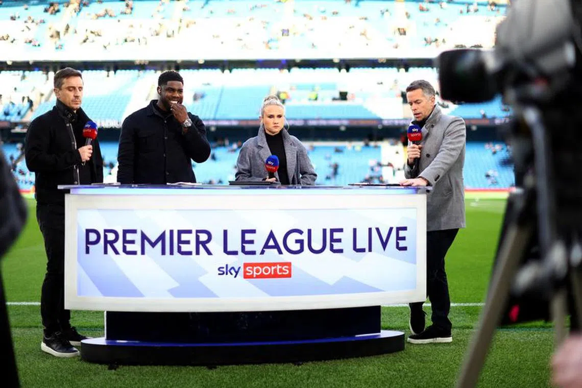 FILE PHOTO: Soccer Football - Premier League - Manchester City v West Ham United - Etihad Stadium, Manchester, Britain - May 3, 2023 Sky Sports television presenter David Jones alongside pundits Izzy Christiansen, Micah Richards and Gary Neville before the match REUTERS/Carl Recine/File Photo