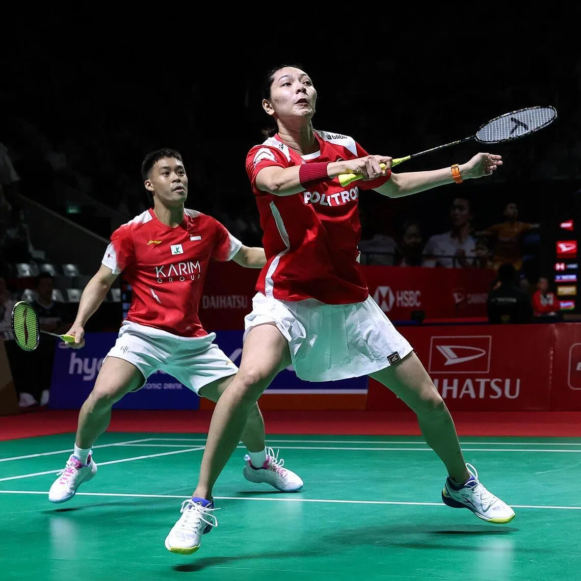 Terry Hee of Singapore and Gloria Widjaja of Indonesia compete against China's Cheng Xing and Zhang Chi in the mixed doubles at the Indonesia Masters.