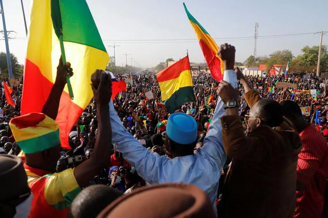 FILE PHOTO: Supporters participate in a demonstration called by Yerewolo Debout sur les remparts, an anti-France political movement, in Bamako, Mali, February 4, 2022. REUTERS/Paul Lorgerie