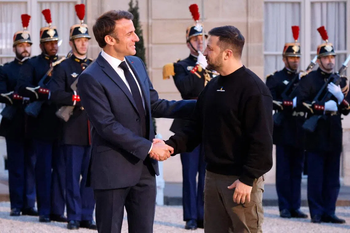 Ukraine's President Volodymyr Zelensky is welcomed by France's President Emmanuel Macron at the Elysee presidential palace.