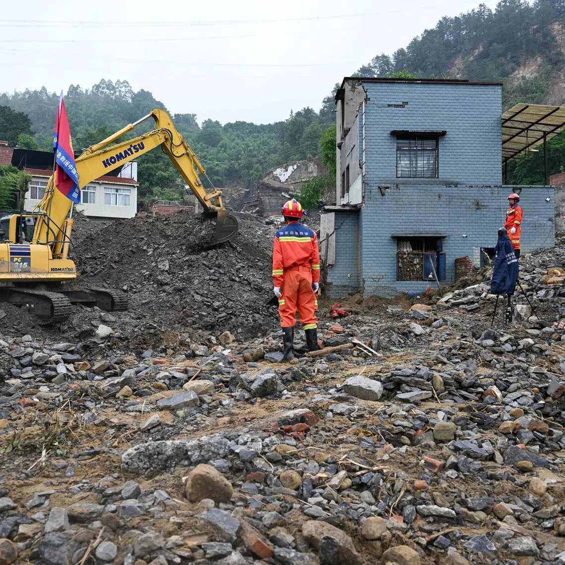 Rescue workers conduct a search-and-rescue operation in Anxi village following flash floods and landslides triggered by extreme rainfall in Yongchuan district, Chongqing, China, May 25, 2026. cnsphoto via REUTERS