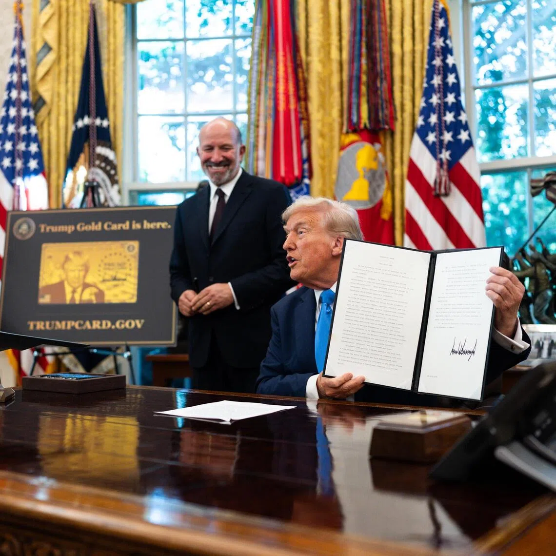 US President Donald Trump after signing a proclamation instituting a $100,000 (S$128,439) fee for visas given to some highly skilled foreign workers.