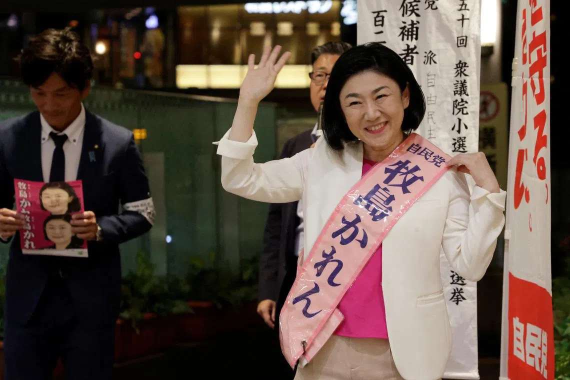 Karen Makishima, a Liberal Democratic Party (LDP) candidate for the upcoming general election, greets residents on the first day of her campaign in front of a train station in Odawara, Kanagawa Prefecture, Japan, October 15, 2024. REUTERS/Irene Wang