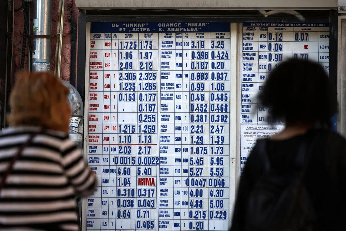 People queue outside a currency exchange office, in Sofia, Bulgaria June 4, 2025. REUTERS/Stoyan Nenov
