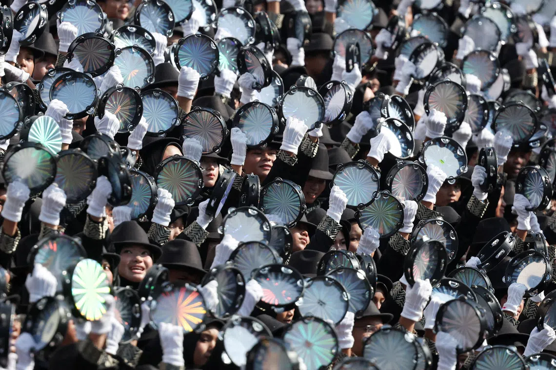 Performers play tambourines during the 69th National Day celebration in Putrajaya, Malaysia, August 31, 2026. REUTERS/Hasnoor Hussain TPX IMAGES OF THE DAY