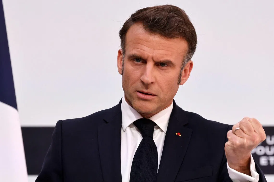 France's President Emmanuel Macron speaks during a press conference following a summit for "coalition of the willing" at the Elysee Palace, in Paris, on March 27, 2025. 