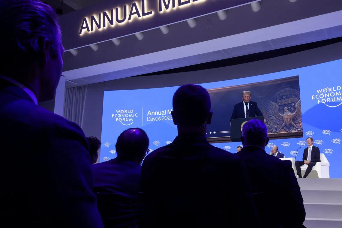 FILE PHOTO: U.S. President Donald Trump makes a special address remotely during the 55th annual World Economic Forum (WEF) meeting in Davos, Switzerland, January 23, 2025. REUTERS/Yves Herman/File Photo