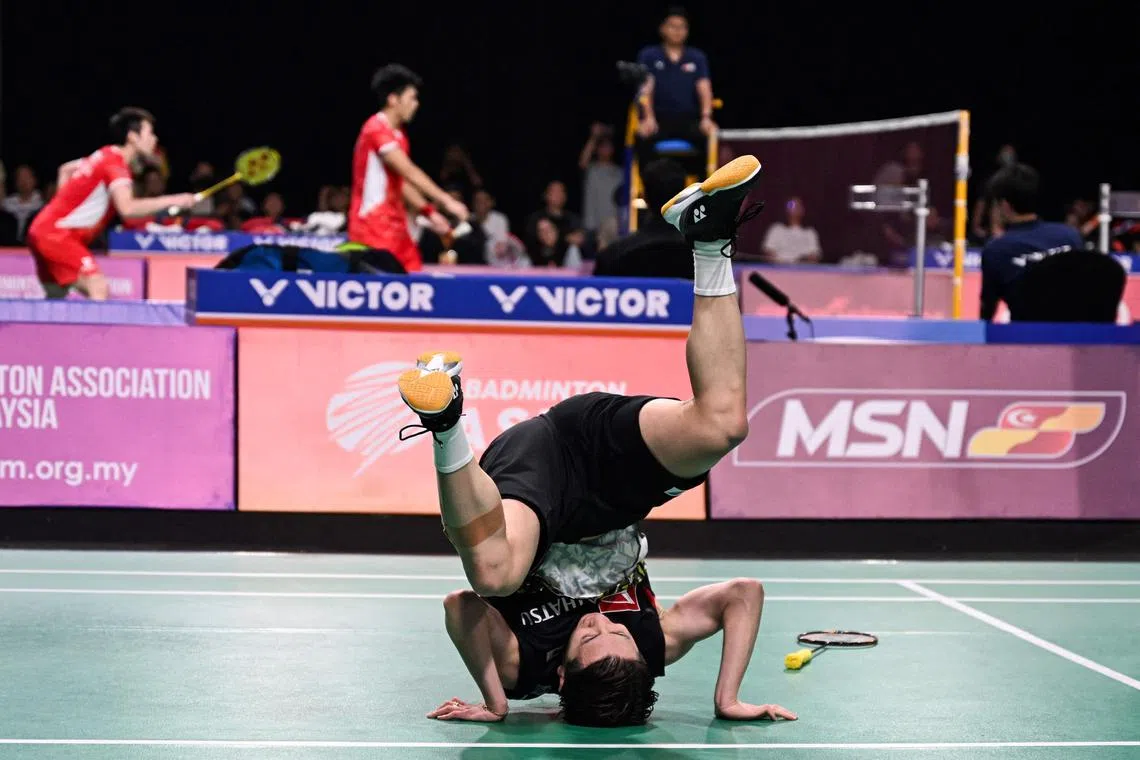 Japan's Koki Watanabe celebrates after winning against Malaysia's Leong Jun Hao in their men's singles semi-finals match at the 2024 Badminton Asia Team Championships.