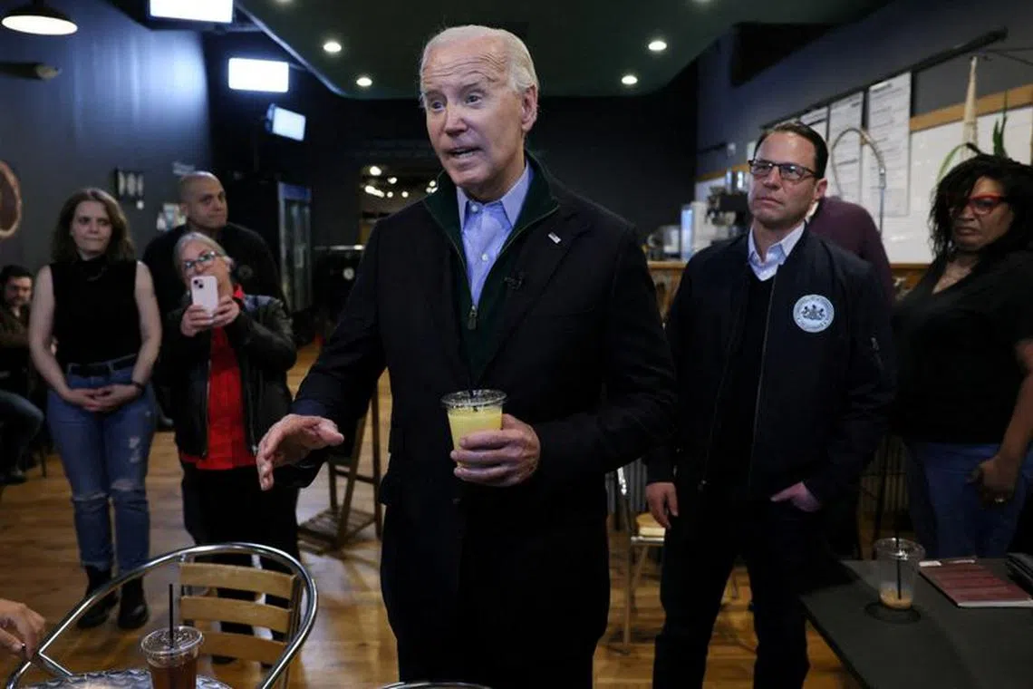 FILE PHOTO: U.S. President Joe Biden answers questions from the press at Nowhere Coffee Co. in Emmaus, Pennsylvania, U.S., January 12, 2024. REUTERS/Leah Millis/File Photo