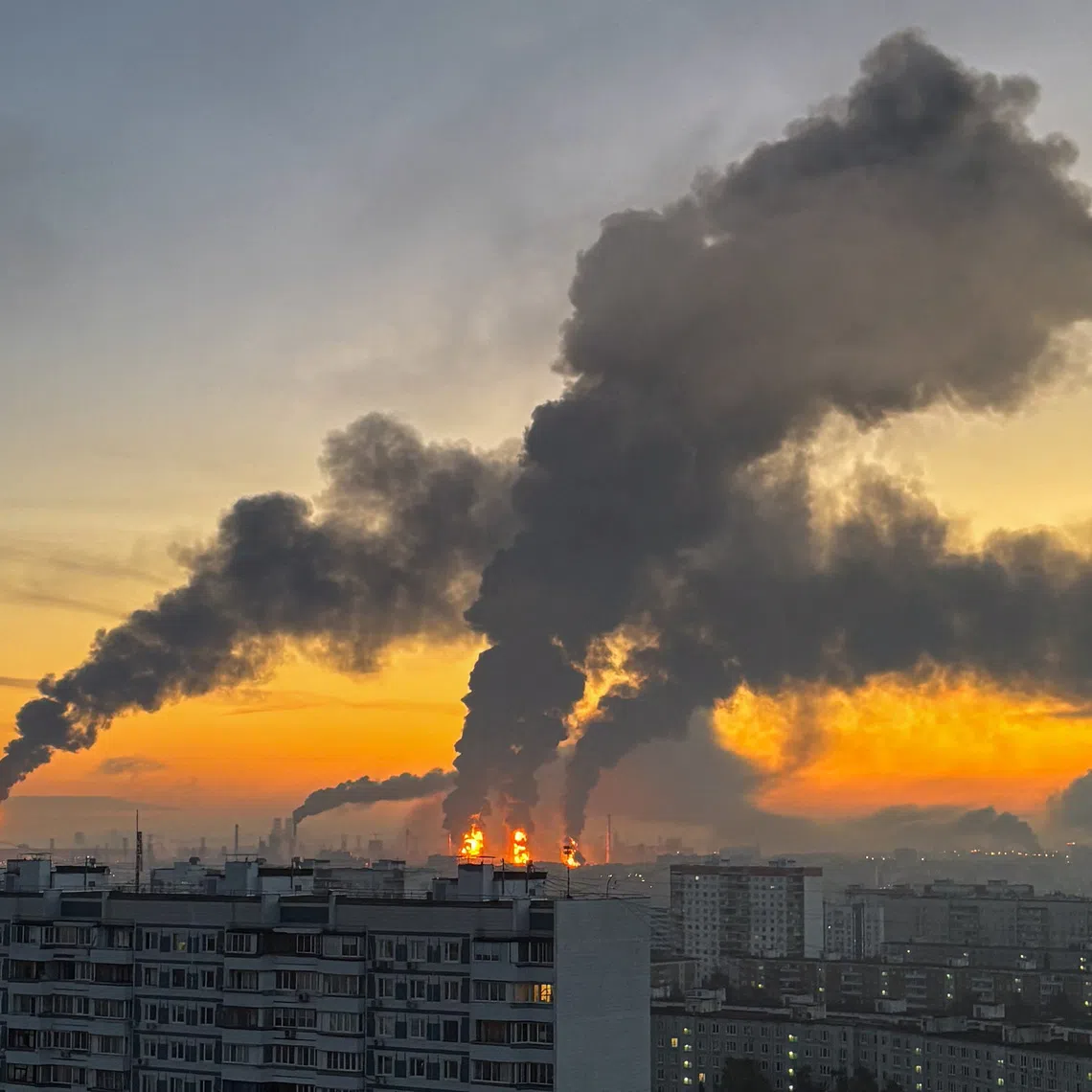 Plumes of smoke rise from fires at an oil refinery following what the authorities say is a Ukrainian drone strike in the course of the Russia-Ukraine conflict on Sept 20.