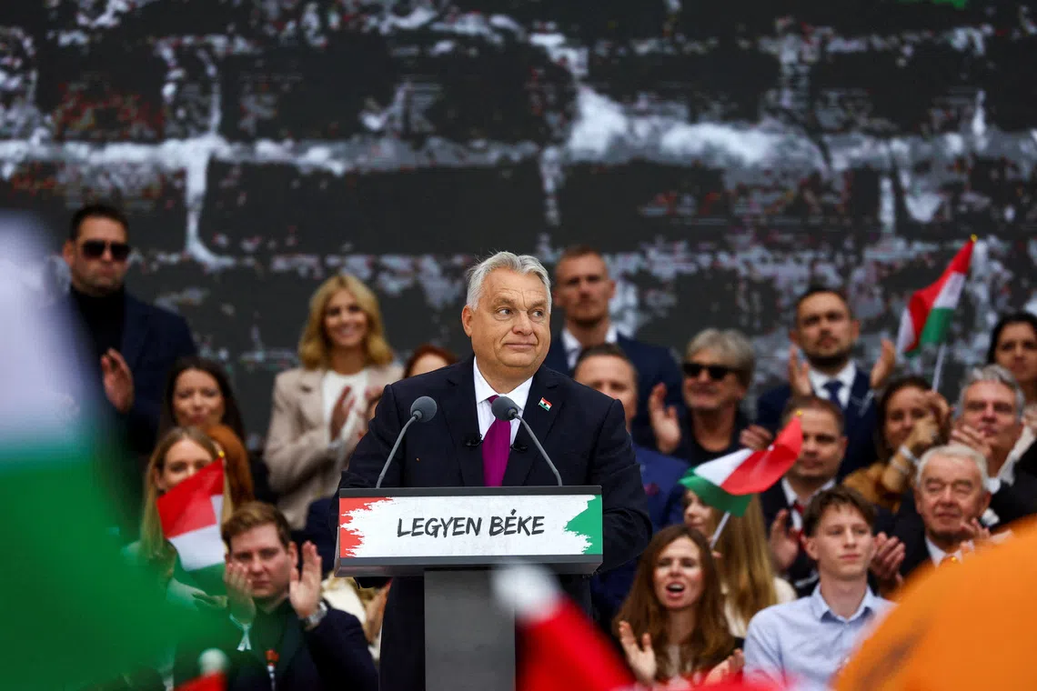 FILE PHOTO: Hungarian Prime Minister Viktor Orban reacts as he delivers a speech to mark the 69th anniversary of the Hungarian Uprising of 1956, in Budapest, Hungary, October 23, 2025. REUTERS/Bernadett Szabo/File Photo