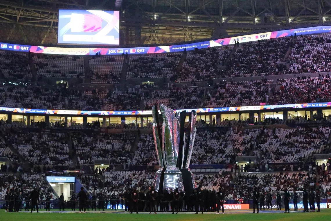 FILE PHOTO: Soccer Football - AFC Asian Cup - Final - Jordan v Qatar - Lusail Stadium, Lusail, Qatar - February 10, 2024 A giant AFC Asian Cup trophy is displayed inside the stadium before the match REUTERS/Ibraheem Al Omari/File Photo