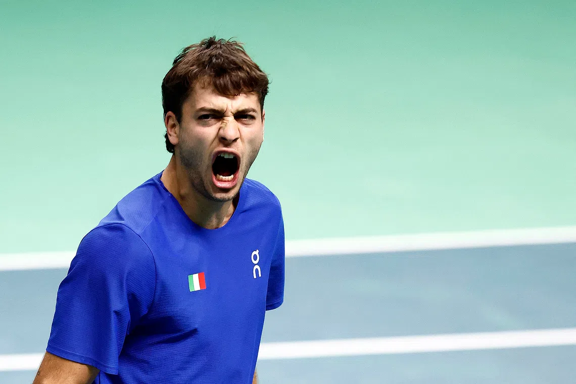 Tennis - Davis Cup - Final 8 - Semi Final - Italy v Belgium - SuperTennis Arena, Bologna, Italy - November 21, 2025   Italy's Flavio Cobolli reacts during his singles match against Belgium's Zizou Bergs REUTERS/Alessandro Garofalo