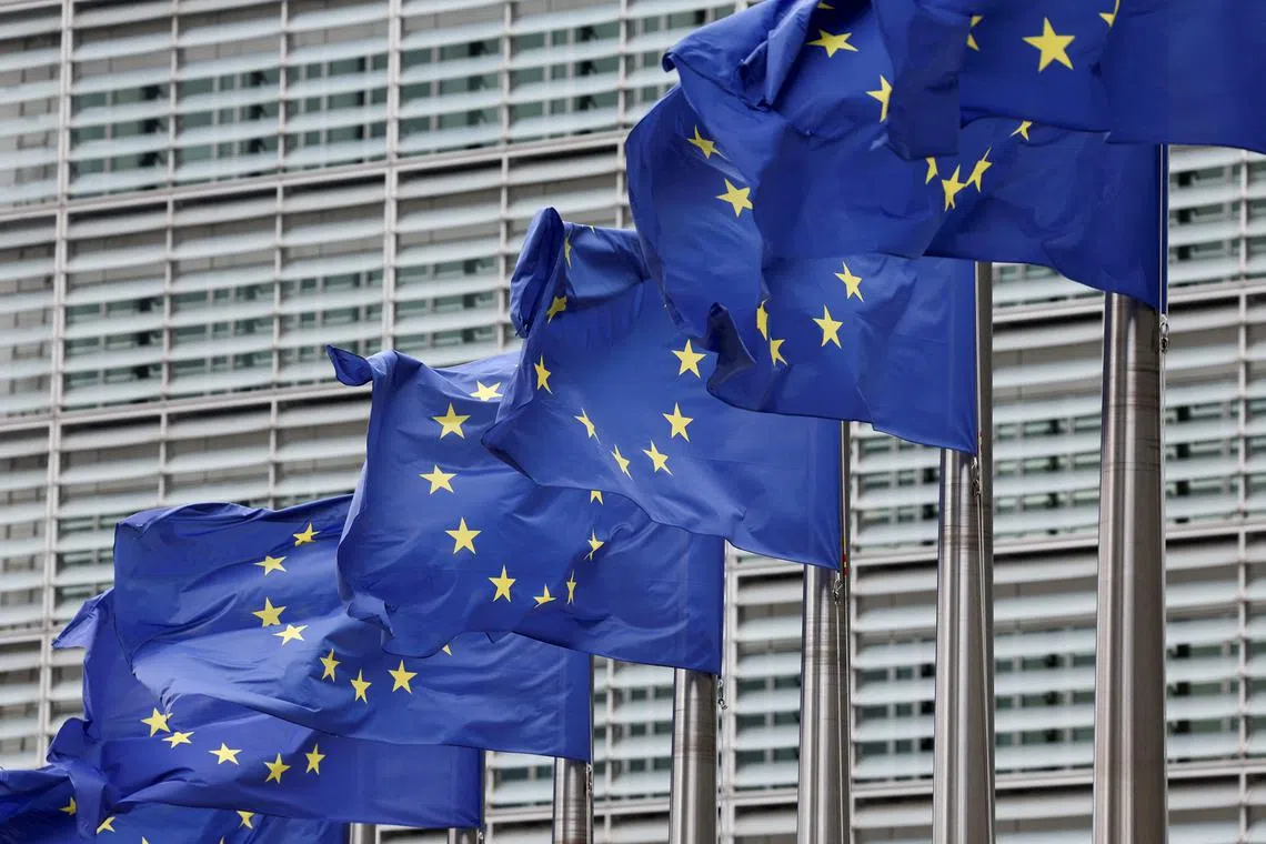 FILE PHOTO: European Union flags flutter outside the EU Commission headquarters in Brussels, Belgium July 16, 2025. REUTERS/Yves Herman/File Photo
