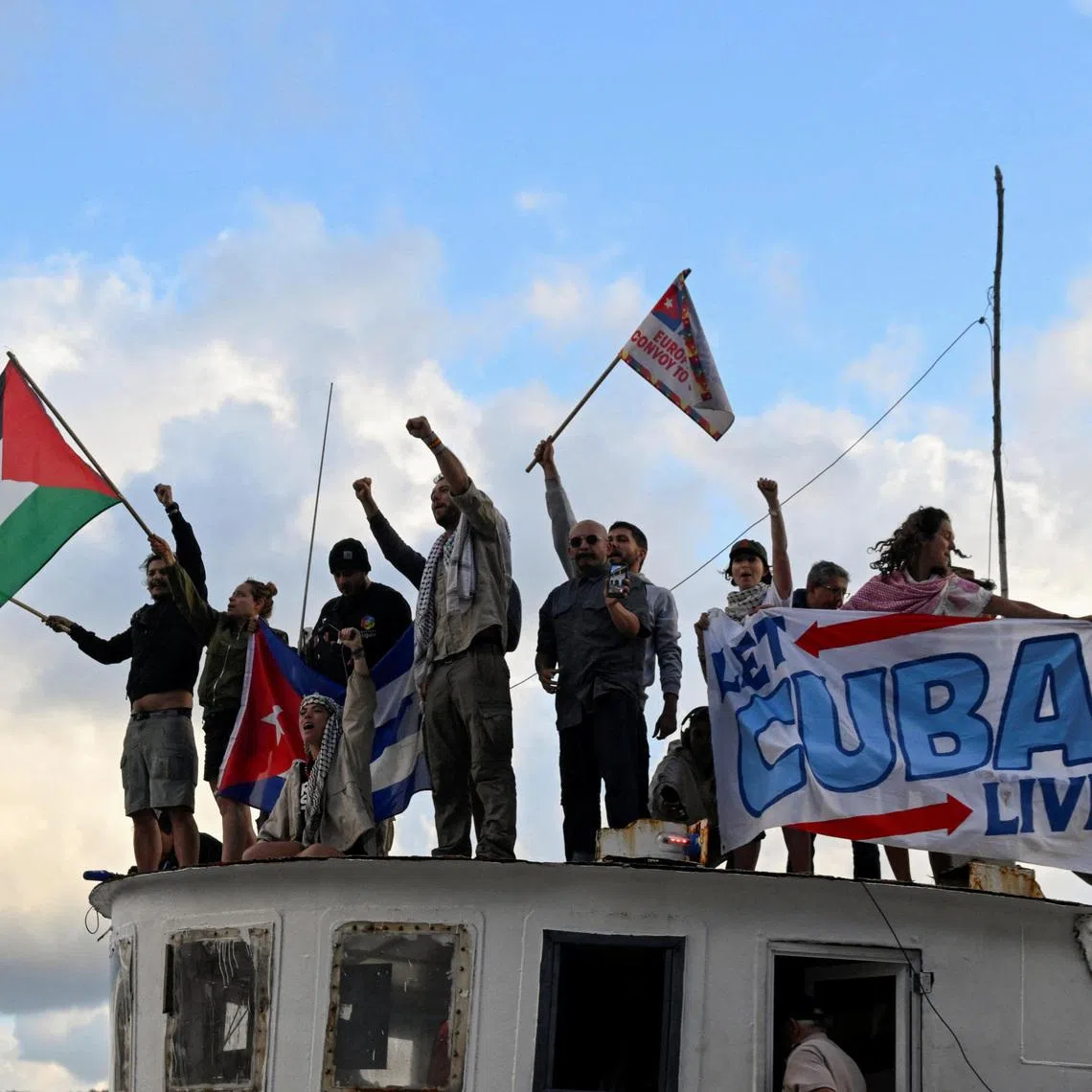 Activists and members of a flotilla coming from Mexico and carrying aid react upon their arrival to Havana’s bay amid a U.S. oil blockade that has dealt a major blow to the island's already ailing energy infrastructure, in Havana, Cuba, March 24, 2026. REUTERS/Norlys Perez