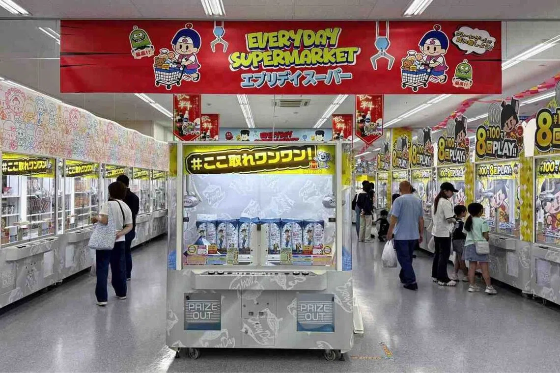 Visitors try their luck at 105 different claw machines inside the Everyday Supermarket.