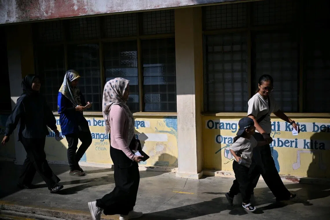 Voters at Tanjung Puteri Primary School in Larkin, Johor, on polling day.