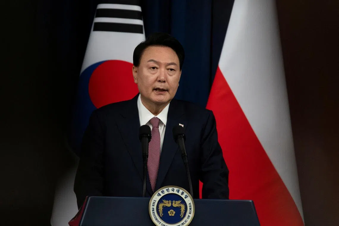 FILE PHOTO: South Korean President Yoon Suk-yeol speaks with Polish President Andrzej Duda (not pictured) during a joint press conference at the Presidential Office in Seoul, South Korea, 24 October 2024. JEON HEON-KYUN/Pool via REUTERS/File Photo

