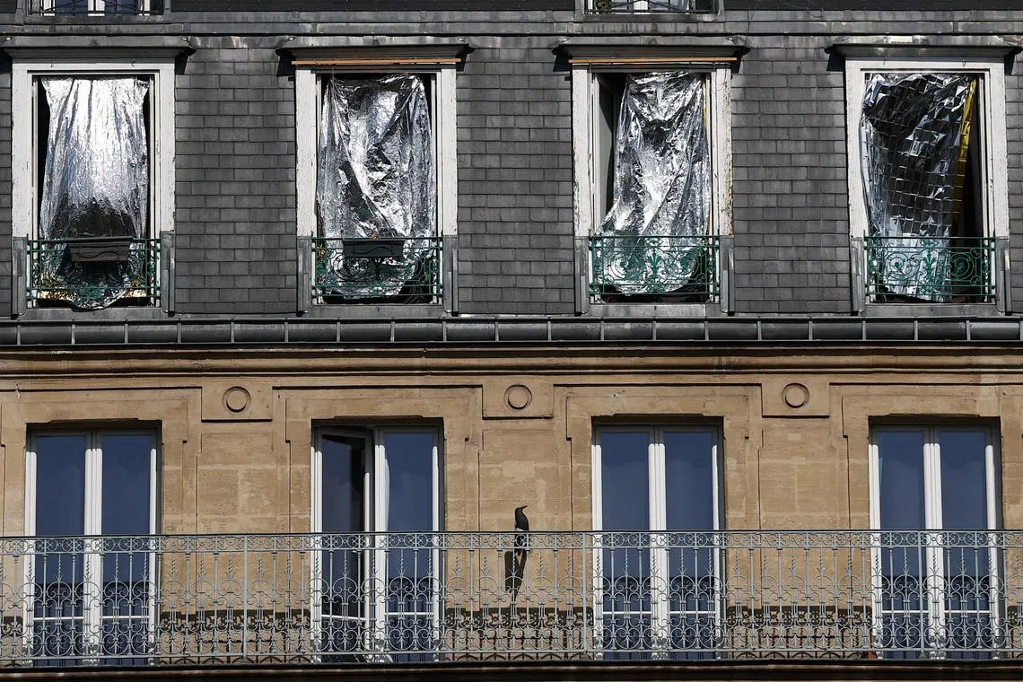 The windows of residential building seen covered with emergency blankets as a shield from the sun as temperatures rise in Paris on June 25. Temperatures in the capital reached 40.3 deg C on June 24.
