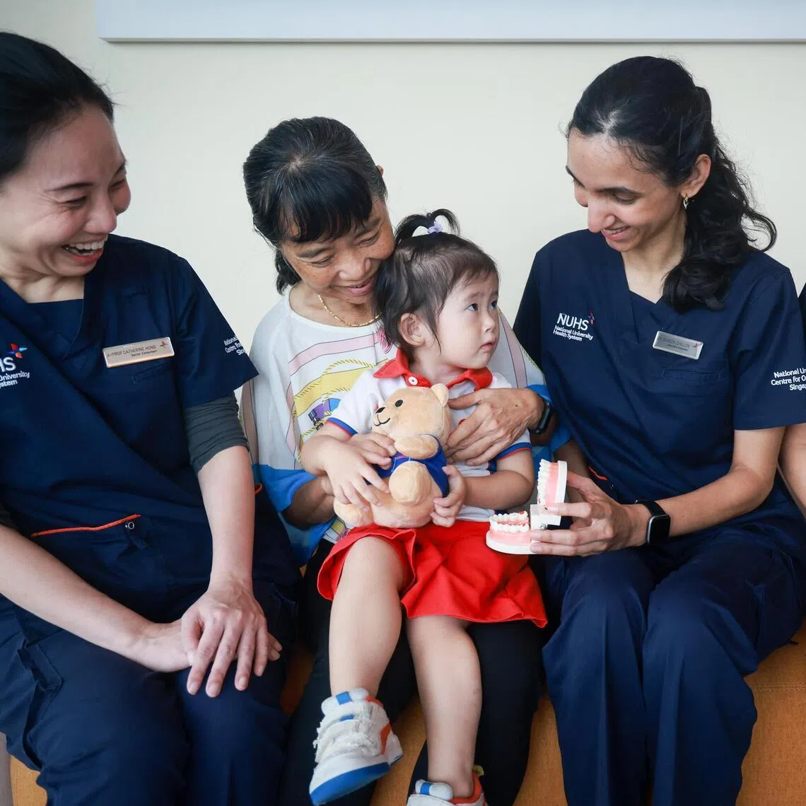 (From left) A/Prof Catherine Hong, Vice Dean (Research, Innovation and Enterprise), NUS Dentistry and Senior Consultant, Division of Paediatric Dentistry, NUCOHS, Mdm Peggy Tan and her granddaughter Rhianne Lee, HEADS-UPP tele-dentistry programme participant, Dr Ishreen Dhillon, Associate Consultant, Division of Paediatric Dentistry, NUCOHS and Academic Fellow, NUS Dentistry, Adj A/Prof Chong Shang Chee, Head of Division and Senior Consultant, Division of Developmental and Behavioural Paediatrics, Department of Paediatrics, Khoo Teck Puat-National University Children's Medical Institute, NUH, and programme lead of HEADS-UPP pictured April 22, 2026.