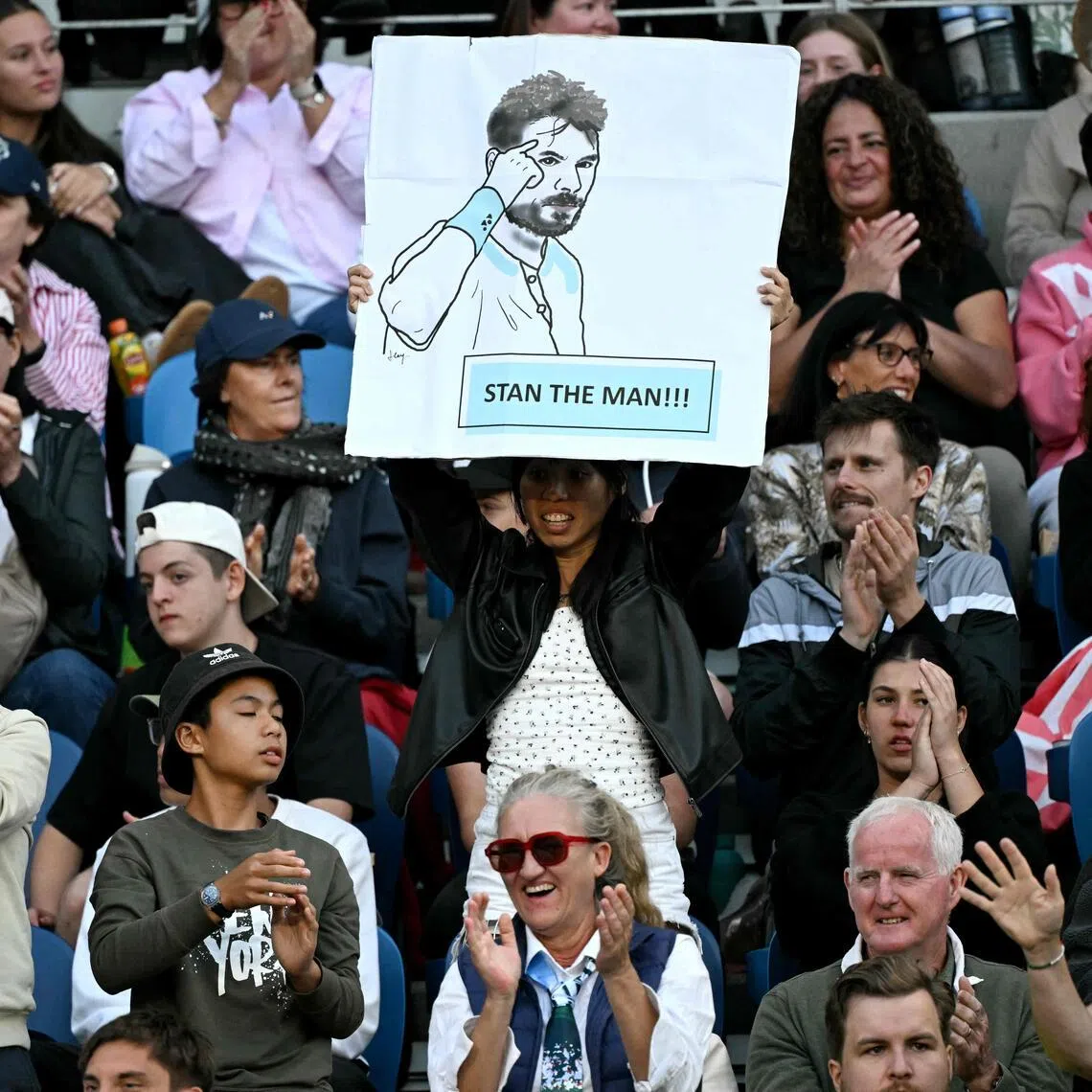 A fan holds a poster of Switzerland’s Stan Wawrinka during the second round of the Australian Open.