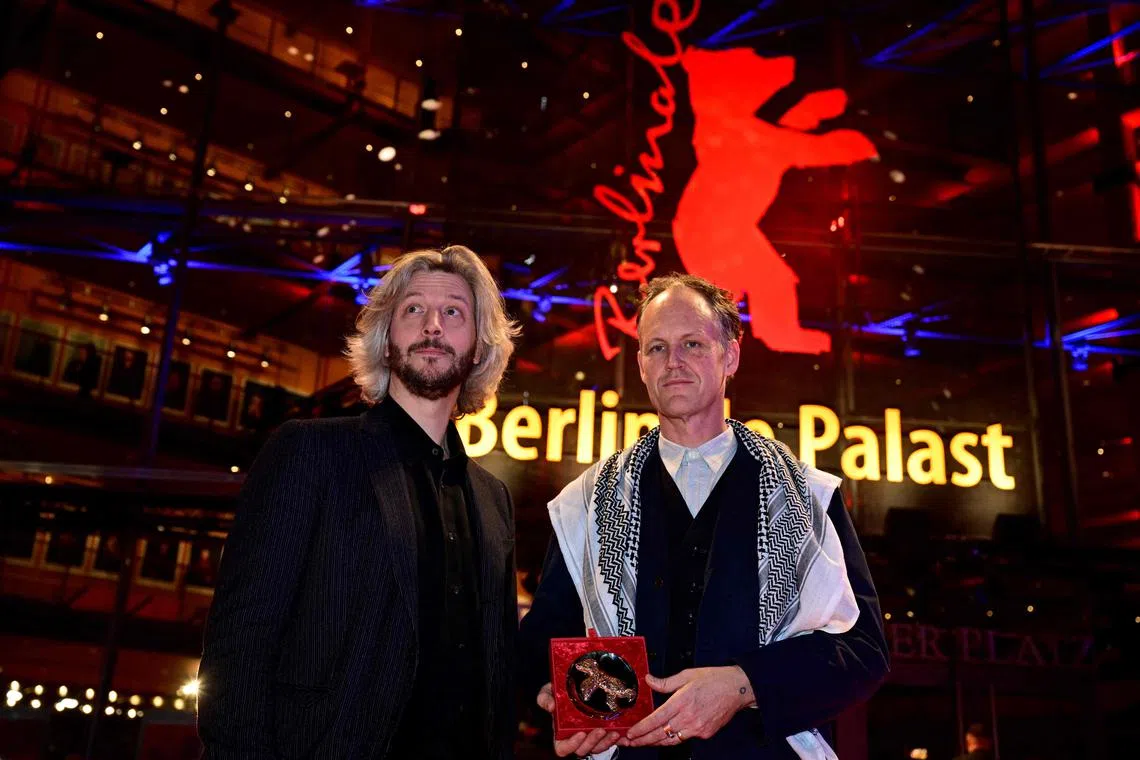 Film makers Ben Russell (right) and Guillaume Cailleau pose with the Encounters Award. The former was wearing a Palestinian scarf.