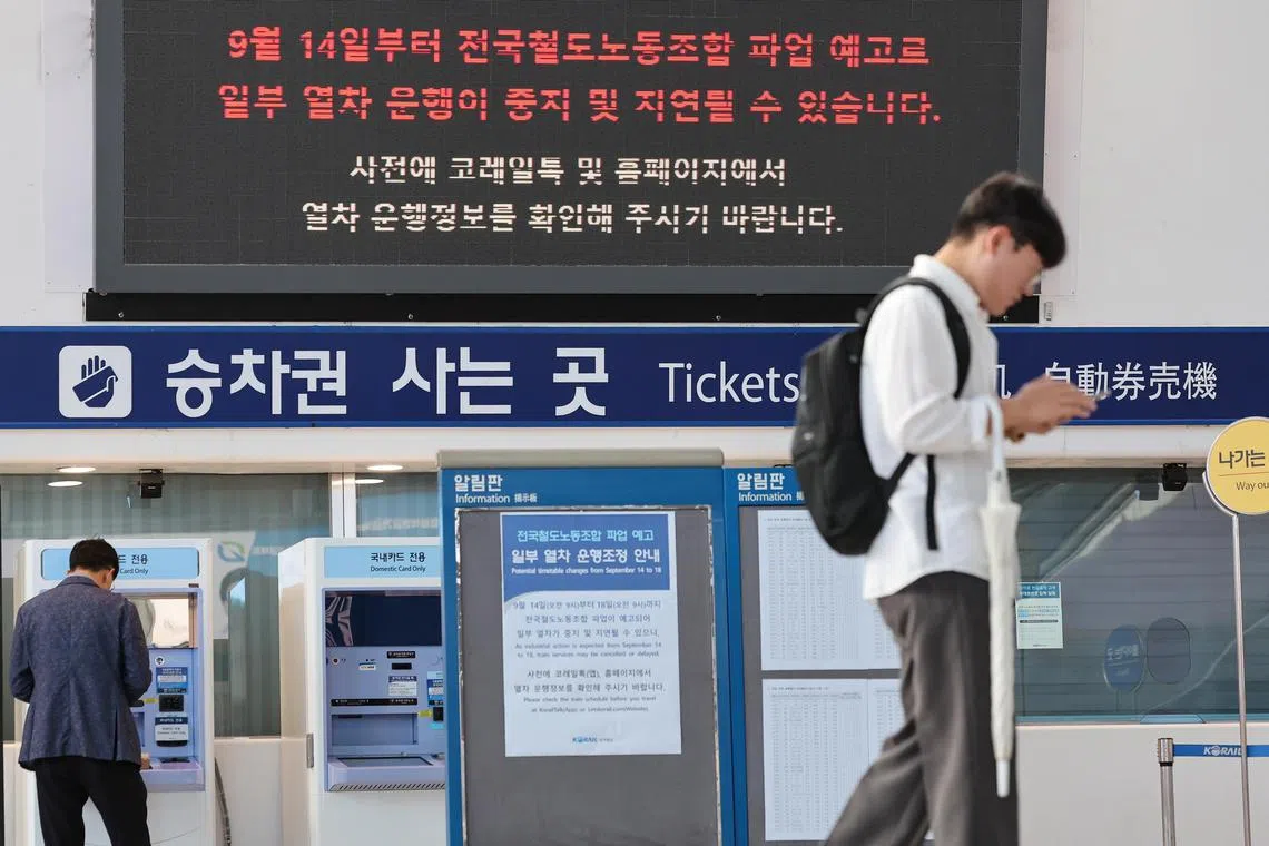 An electronic signboard informs commuters that unionised rail workers went on a four-day general strike; at Seoul Station in Seoul.