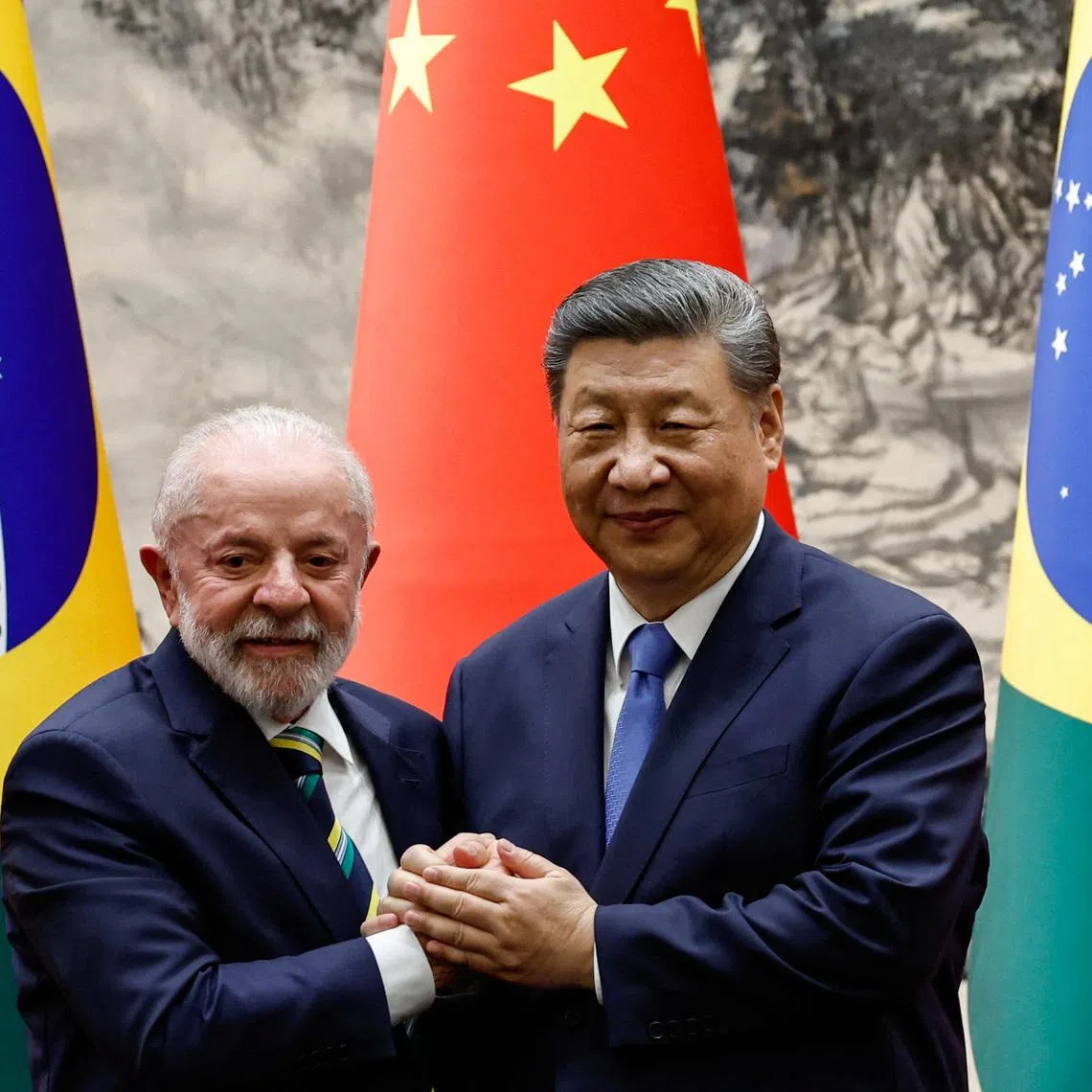 Chinese President Xi Jinping shakes hands with Brazil's President Luiz Inacio Lula da Silva at a joint press conference, at the Great Hall of the People in Beijing, China, May 13, 2025. REUTERS/Tingshu Wang/Pool/File Photo