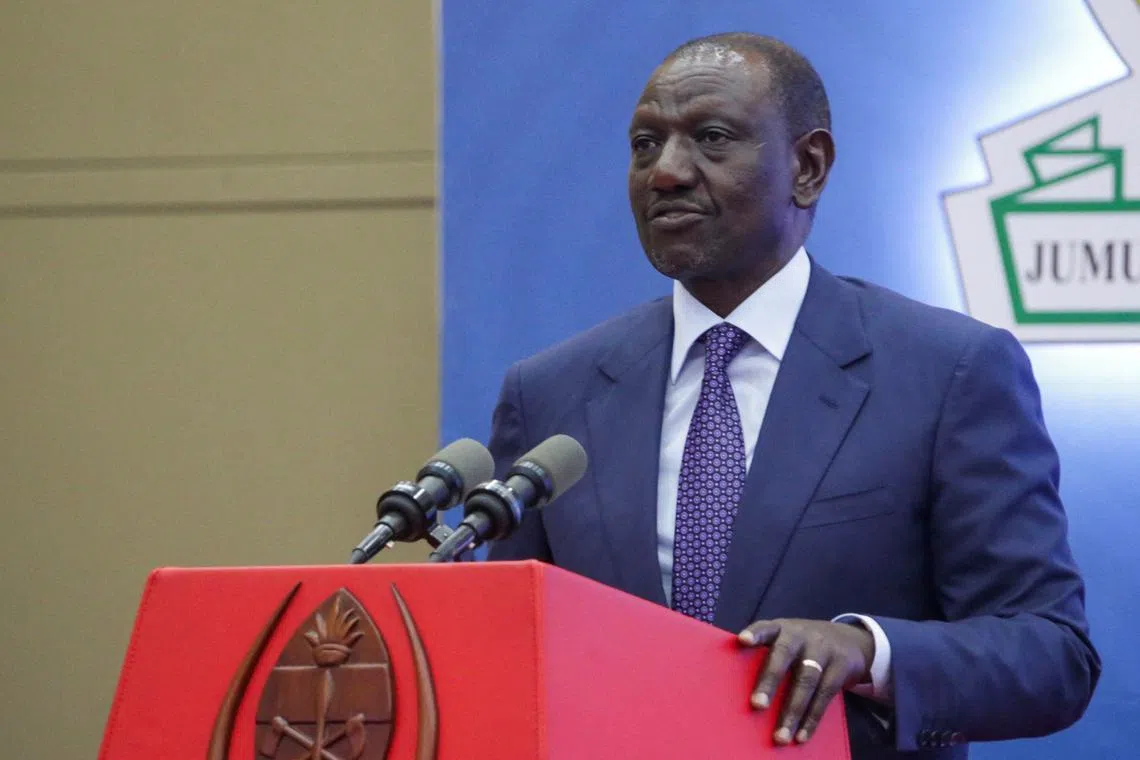 FILE PHOTO: Kenya's President William Ruto addresses delegates at a joint summit from the Southern African Development Community (SADC) and the East African Community (EAC) to discuss the conflict in eastern Congo, in Dar es Salaam, Tanzania February 8, 2025. REUTERS/Emmanuel Herman/File Photo