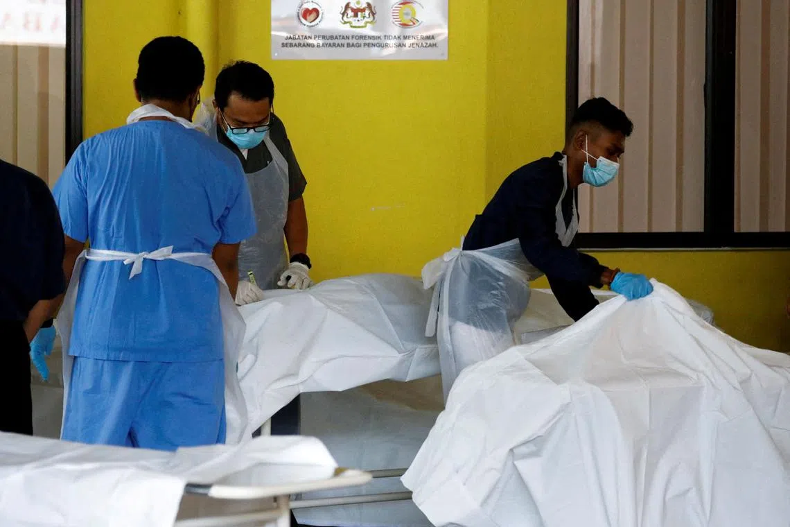Dead bodies of Batang Kali landslide victims are seen at Kuala Lumpur Hospital's mortuary in Kuala Lumpur, Malaysia Dec 16, 2022. 