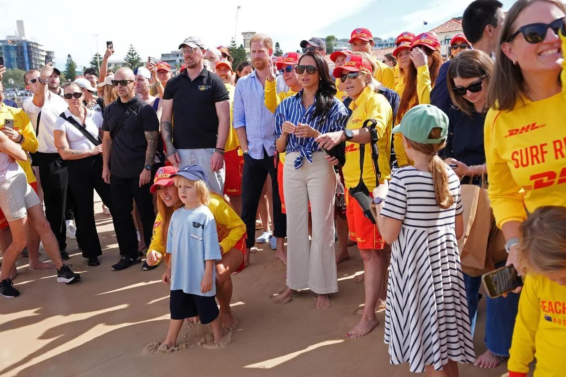 Britain's Prince Harry and Meghan, the Duke and Duchess of Sussex, also met volunteer first responders from Bondi Surf Bathers' Life Saving Club, during a visit to Bondi Beach.