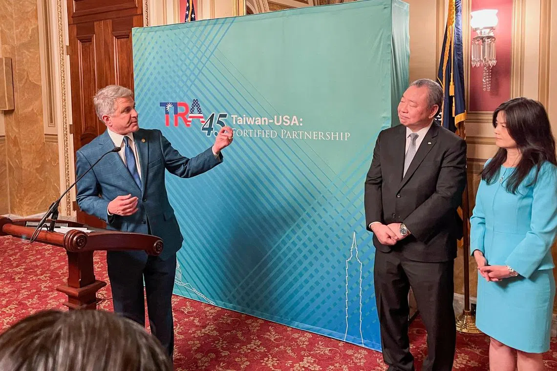 Representative Mike McCaul (left)  addresses an event alongside Taiwan’s representative in Washington, Mr Tah-Ray Yui (centre), and Mr Yui’s wife Karen Lo at the US Capitol.