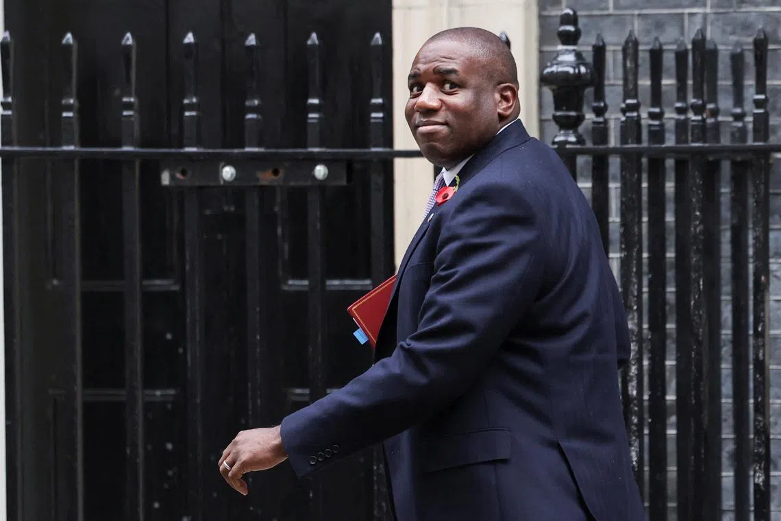 FILE PHOTO: Britain's Foreign Secretary David Lammy walks on Downing Street, on the day of the budget announcement, in London, Britain October 30, 2024. REUTERS/Isabel Infantes/ File Photo