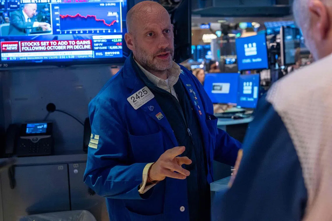Traders work on the floor of the New York Stock Exchange, in New York City. 