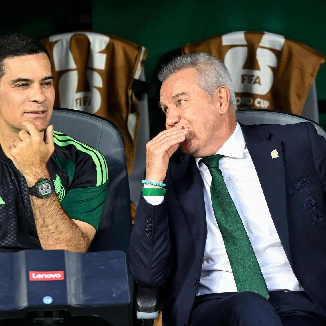 (FILES) Mexico's head coach Javier Aguirre (R) and assistant coach Rafael Marquez (L) talk ahead of the 2026 World Cup Group A football match between the Czech Republic and Mexico at the Mexico City Stadium in Mexico City on June 24, 2026. Mexico officially announced on July 8, 2026 the appointment of former defender Rafael Marquez as the new head coach of the national football team, a change that had been expected following the country’s elimination from the World Cup. ‘Kaiser’ Marquez, aged 47, was part of the coaching staff of the outgoing manager, Javier Aguirre. (Photo by Alfredo ESTRELLA / AFP)
