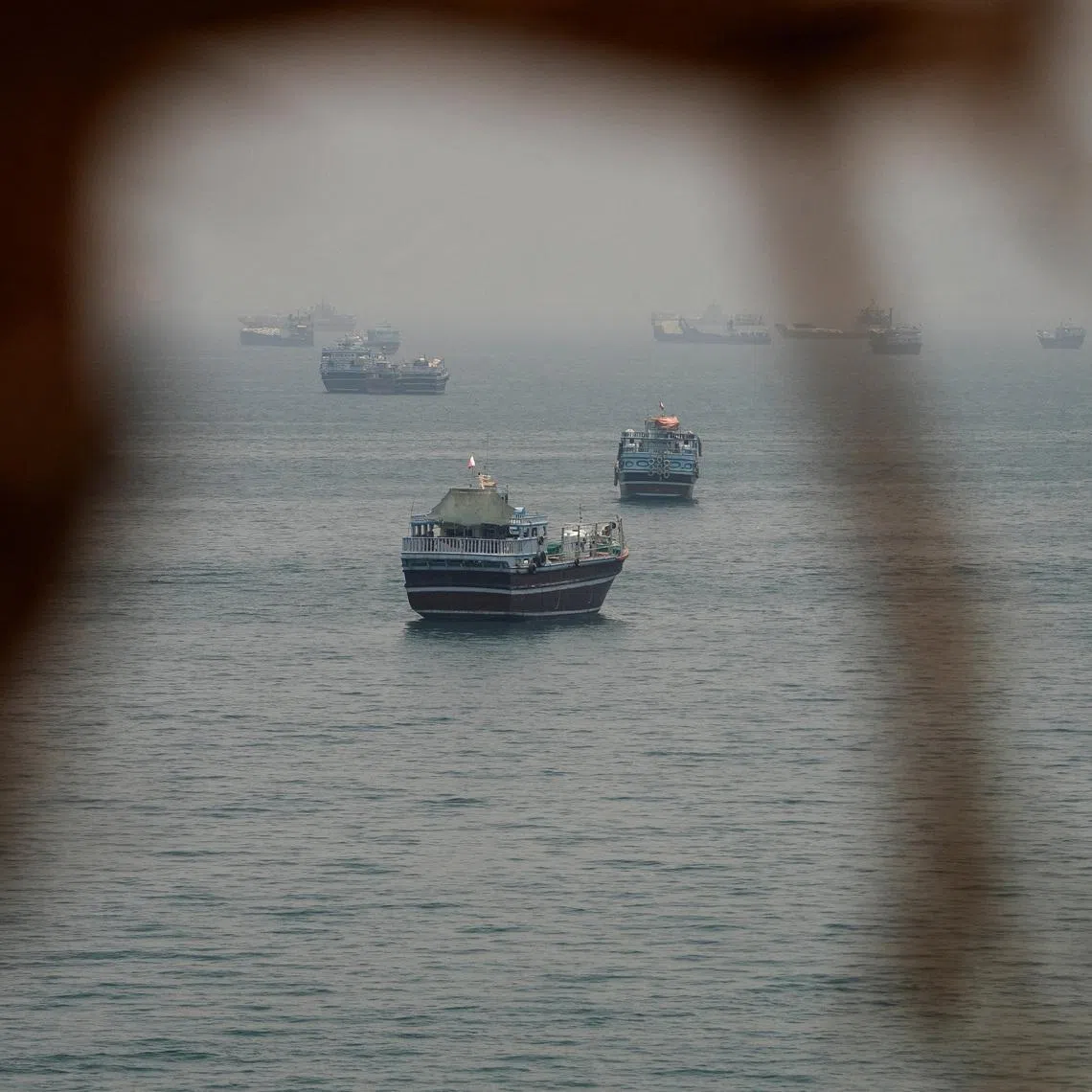Vessels are anchored in the Strait of Hormuz, as seen from Musandam, Oman, June 11, 2026. REUTERS/Stringer