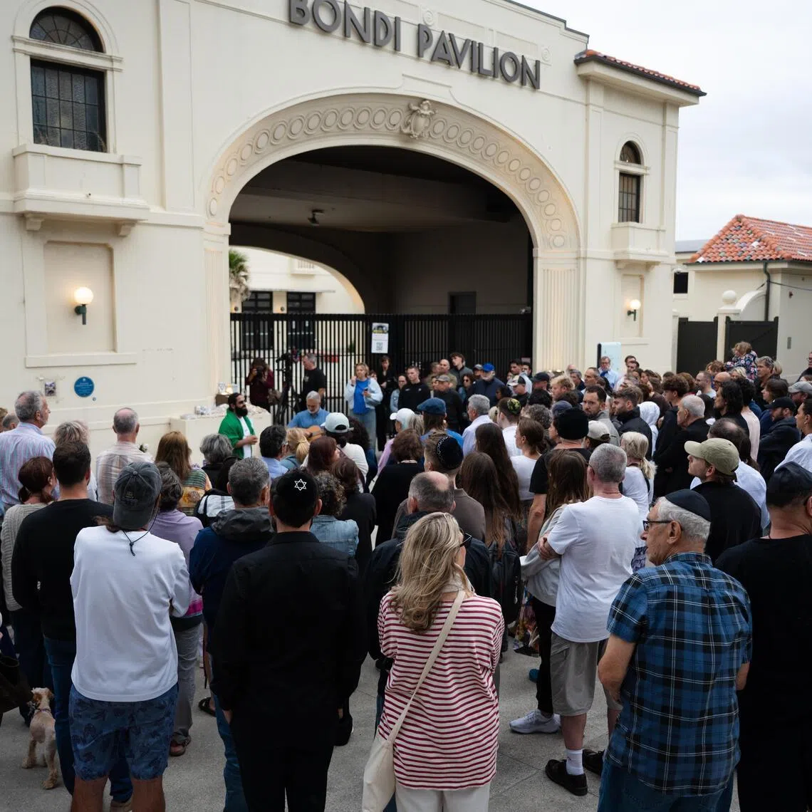 Mourners pay their respect during the Australian National Day of Mourning to honour the victims of the Bondi Beach shooting, in Sydney on Jan 22.