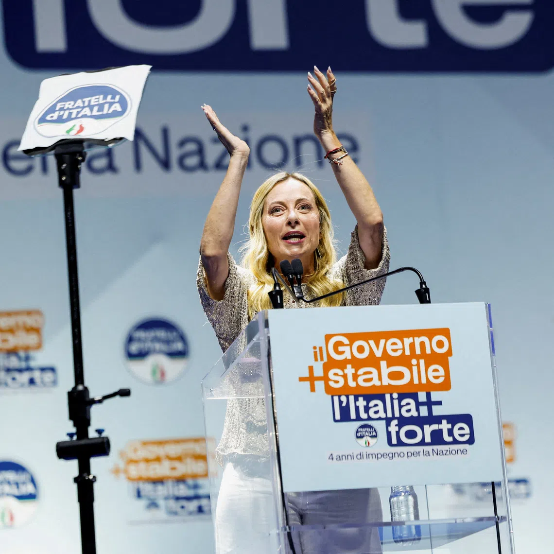 FILE PHOTO: Italian Prime Minister Giorgia Meloni applauds as she delivers closing remarks at a rally celebrating her government's record as the longest-serving administration in Italy's republican history, in Bari, Italy, September 4, 2026. REUTERS/Remo Casilli/File Photo